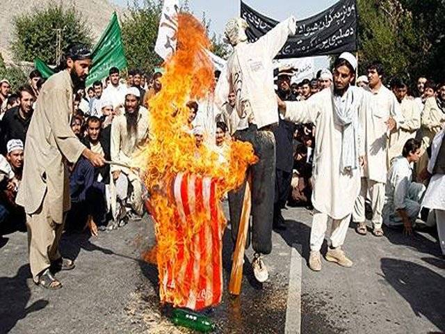 Afghan police open fire after protesters burn effigy of Obama
