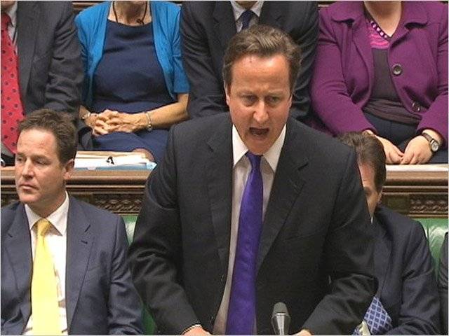 British PM Cameron defends his actions in hacking case