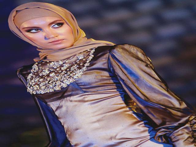 Dubai: A Chechen model displays an Islamic dress, a creation of Firdaws (Paradise) Fashion House, that was founded and is owned by Chechen First Lady Medni Kadyrova, during a fashion show in Dubai.–AFP