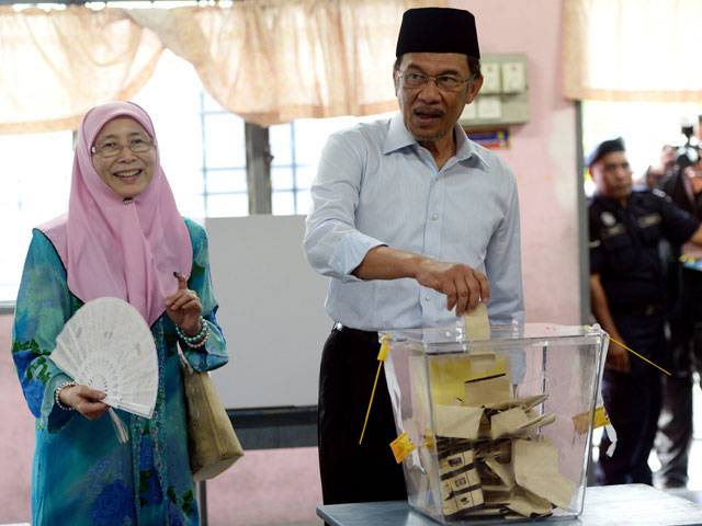 Malaysian voters cast their ballots during general elections