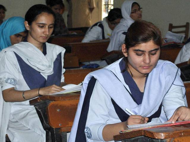 Students busy in solving questions during Intermediate examination