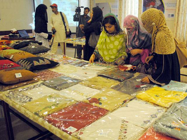 Women visit the stall during Handicraft Exhibition organized by CERD
