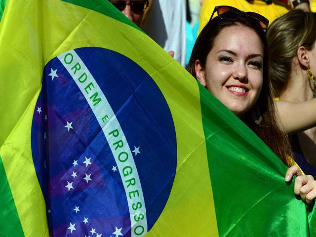 Supporter of Brazil cheers at FIFA Cup Brazil 2013 Group A football match between Italy and Brazil