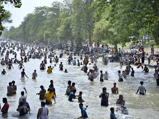 Peoples enjoying the boat ride in River Ravi and swiming in canal to beat the heat 