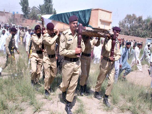 Army Jawans carrying the coffin of martyred soldier Muhammad Irfan who embraced shahadat in Upper Dir Blast for funeral prayers.