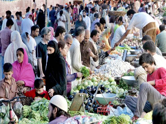 People are busy in shopping at Tajpura Sunday Bazaar in Lahore.