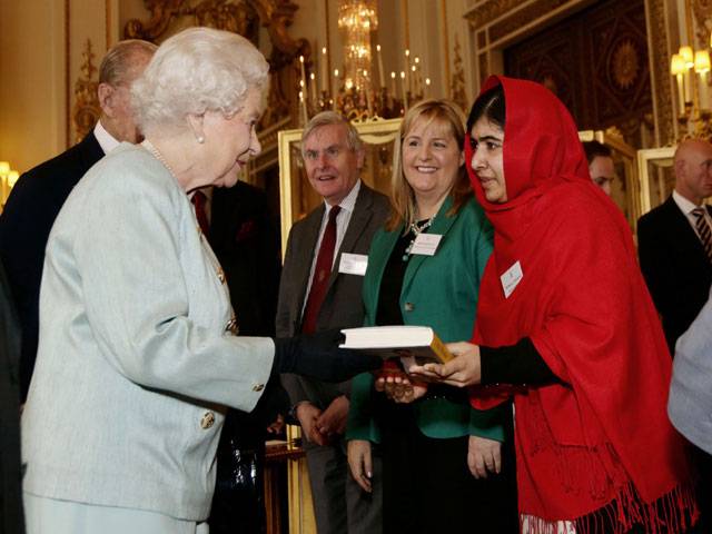 Malala all smiles as she meets Queen Elizabeth