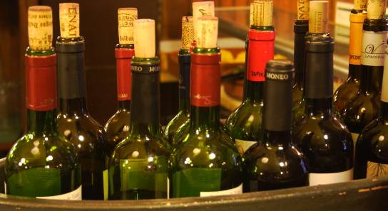 19 outlaws held; 110 wine bottles recovered