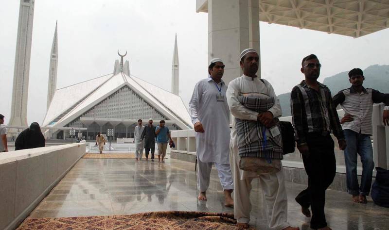 People getting ready for Aitekaf in Faisal Mosque