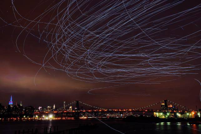LED-lit pigeons illuminate New York skies in art exhibit