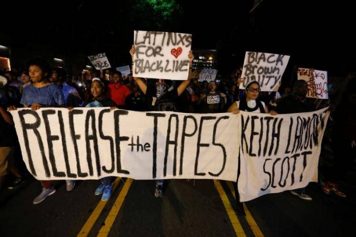 Charlotte marchers demand police release shooting tapes