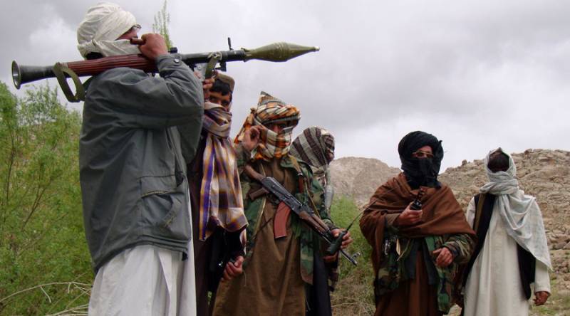 Taliban attack Afghan provincial center, cut highway