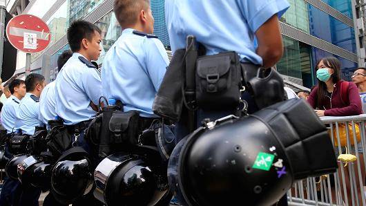 Seven Hong Kong policemen jailed for assault on democracy activist 