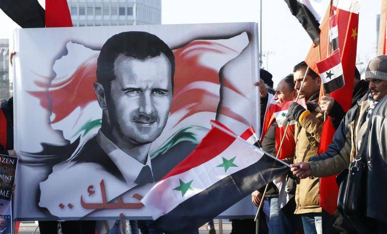 Assad calls U.S. forces 'invaders', but still hopeful on Trump