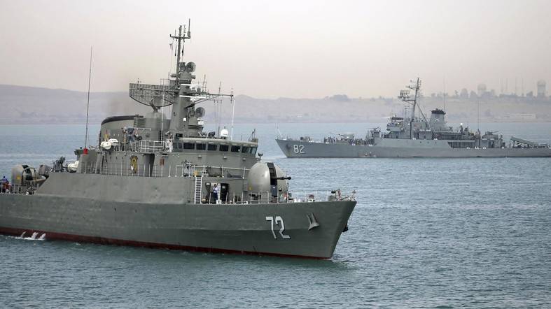 Iran denies harassing U.S. warships in Gulf, warns of clashes