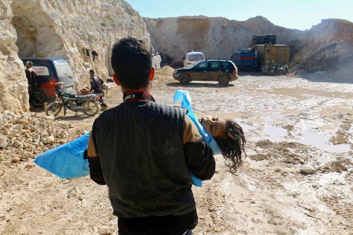 Dozens killed in suspected gas attack on Syrian rebel area