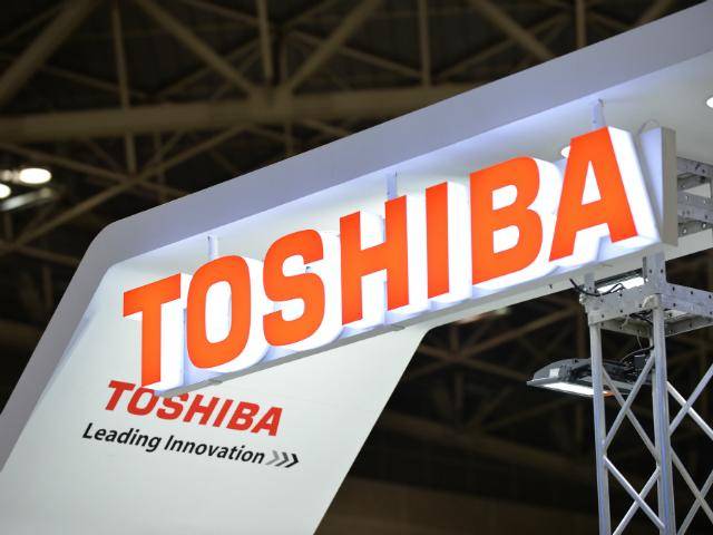 Toshiba files results unapproved by auditor; warns 'its survival in doubt'