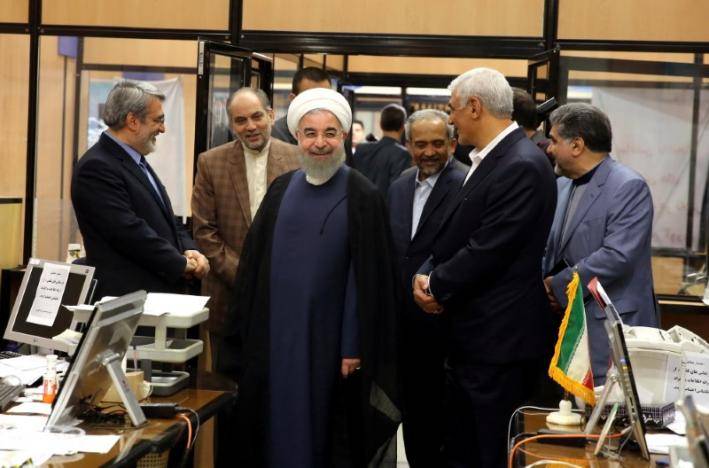 Decisively re-elected, Rouhani defies hardliners, pledges to open Iran
