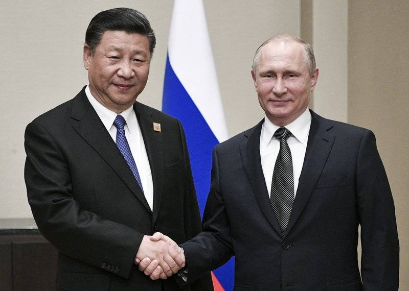 Russian and Chinese leaders meet, hail their close ties