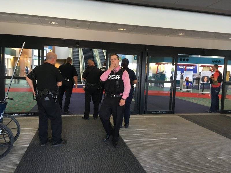 Michigan airport evacuated; officer seen bleeding from neck