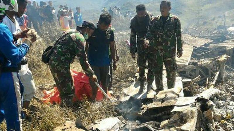 Eight killed in Indonesian helicopter crash as volcano erupts