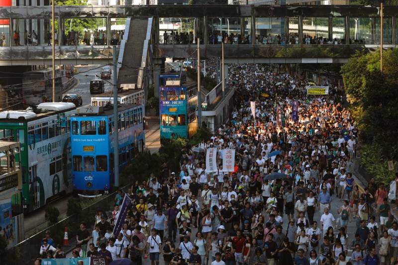 Thousands protest in Hong Kong over jailing of democracy activists