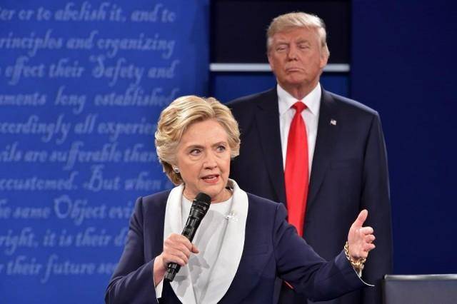 Clinton, in book, says Trump's debate stalking made her skin crawl