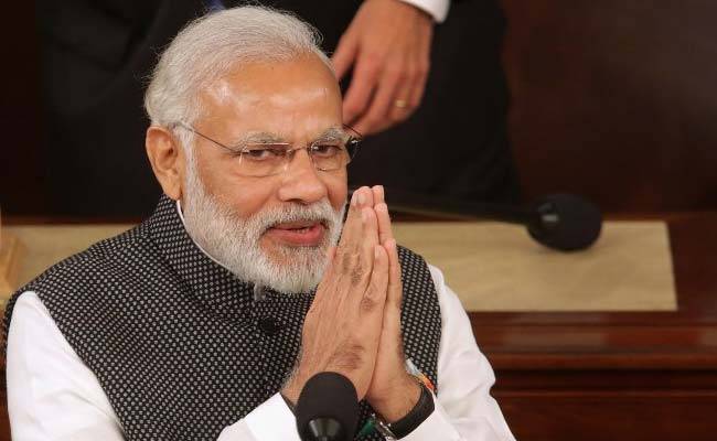 India's PM Modi reshuffles cabinet as economy slips