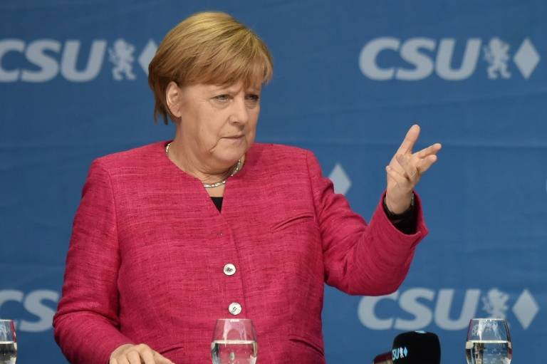 Refugee issue complicates Merkel's bid to form government