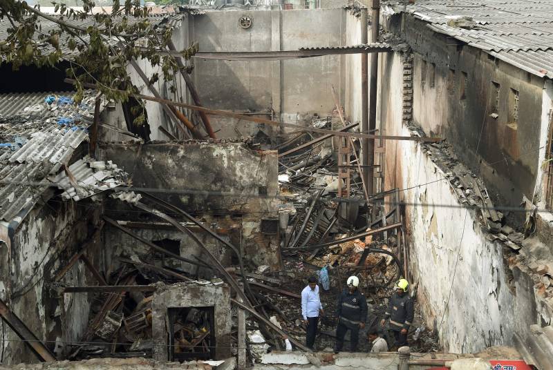 Fire and collapse in Mumbai shop kills 12