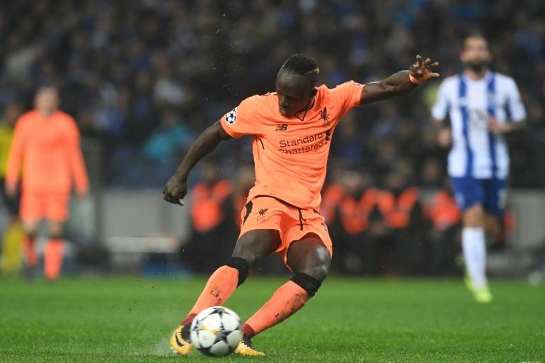 Mane steps out from Salah's shadow for historic hat-trick