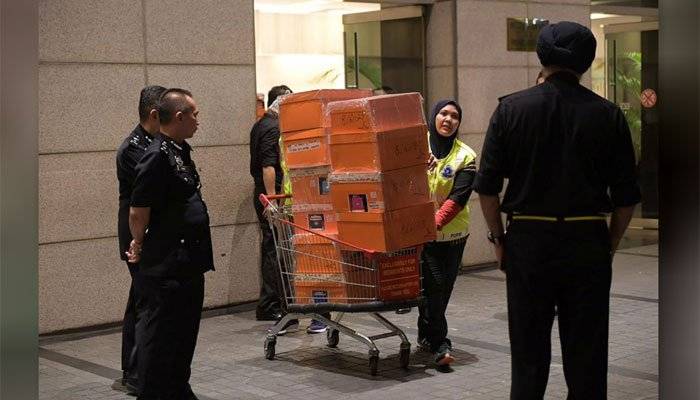 Hundreds of designer bags, jewelry, cash seized in Malaysia from ex-PM