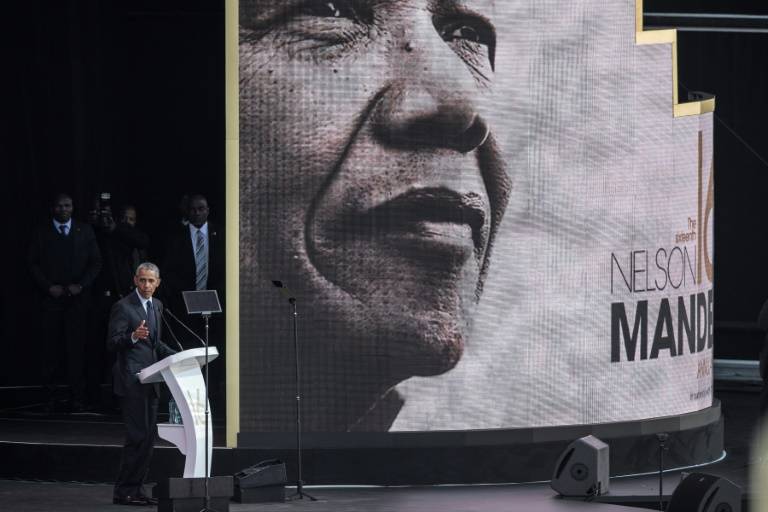 Obama warns of 'strange and uncertain times' in Mandela tribute