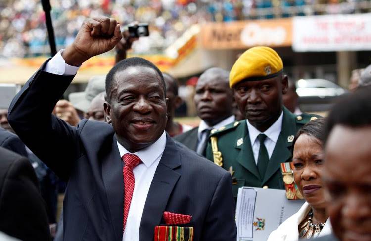 Zimbabwe's president courts white voters ahead of election