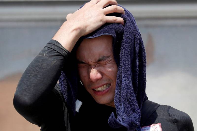 Record heat broils Japan, prompting warnings