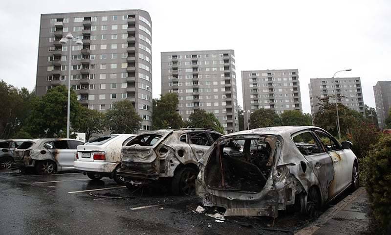 Masked vandals torch dozens of cars in Sweden