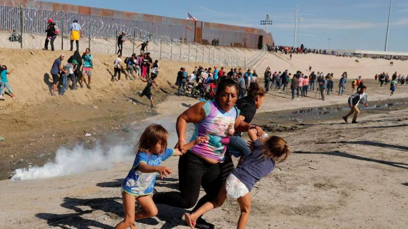 US fires tear gas into Mexico to repel migrants, closes border gate 