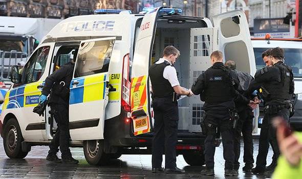 UK police arrests three for attempted murder as car rams into crowd in London