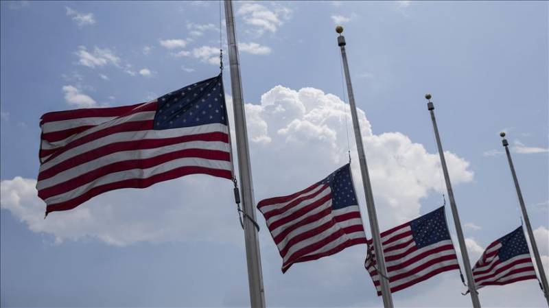 US to lower flags to half-staff to mourn virus victims