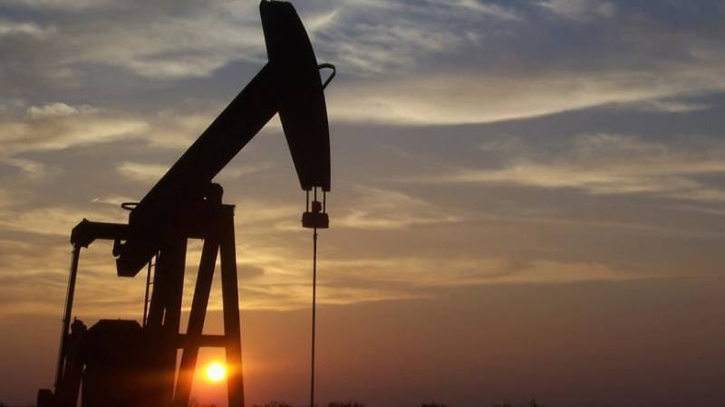 Oil prices steady as weak dollar balances low demand