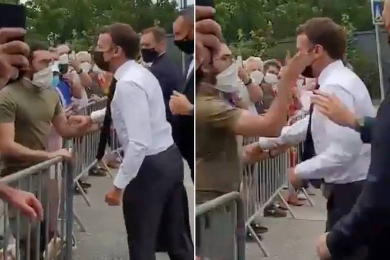 French President Macron gets slapped during tour of France