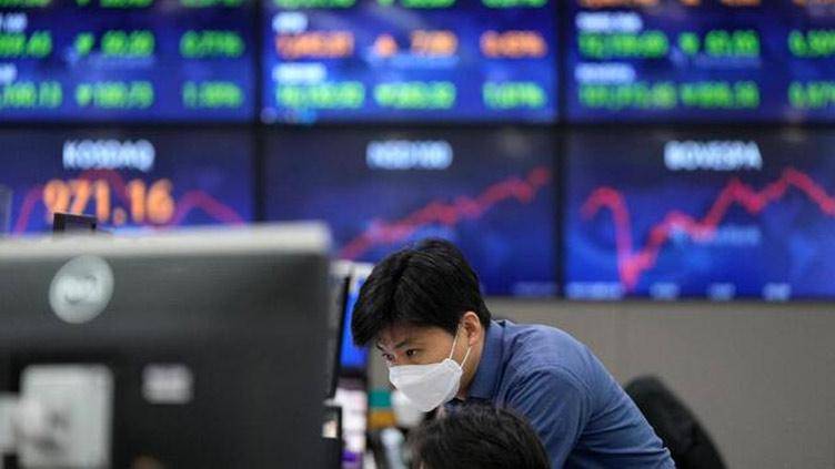 Asian markets mostly down but China data offers some light