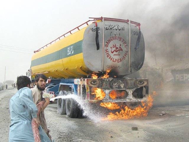 CHAMAN: Firefighters try to extinguish a burning oil tanker carrying fuel for Nato forces, which caught fire after a bomb blast on Wednesday.Reuters