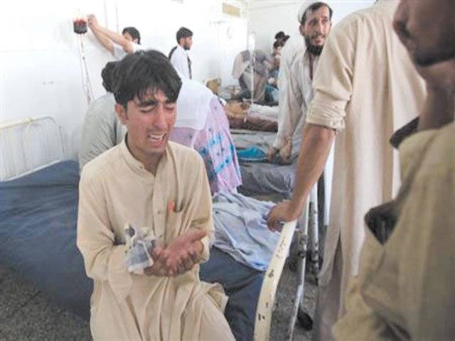 Twin bomb blasts kill 65 in line for wheelchairs