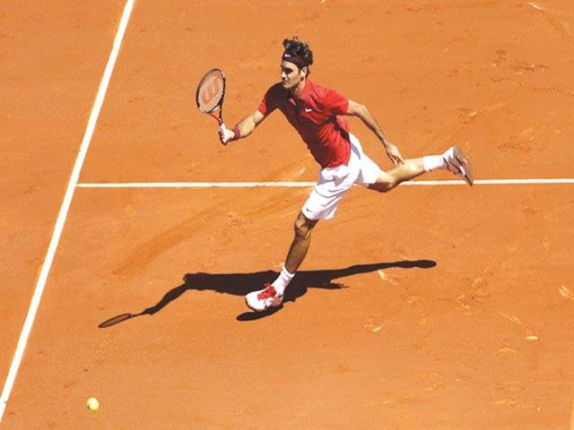 Federer marches on