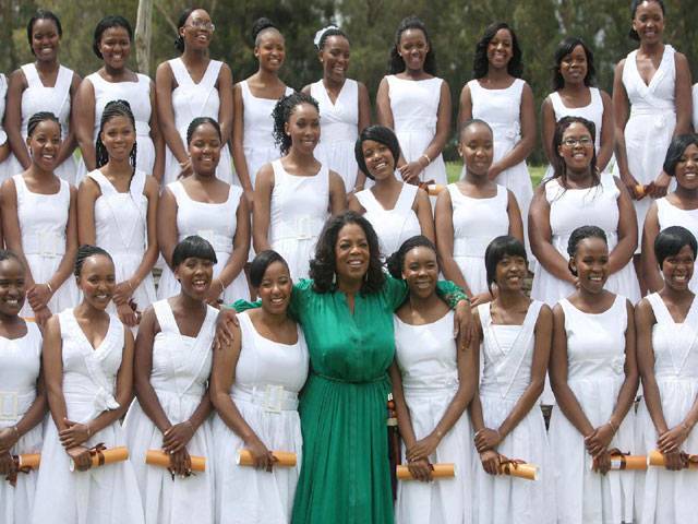 Oprah celebrates with first grads of S Africa school
