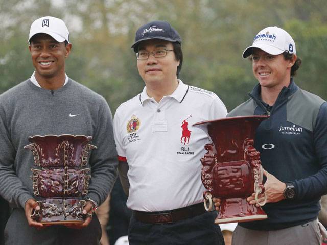 Fan frenzy greets Woods, McIlroy in China