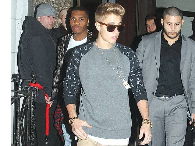 Bieber parties wearing two gold watches