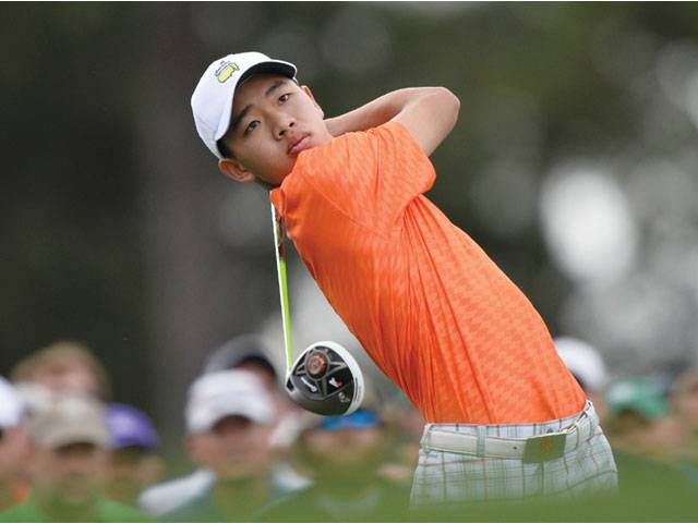 Day leads Masters as Tiger falters; Guan plays on