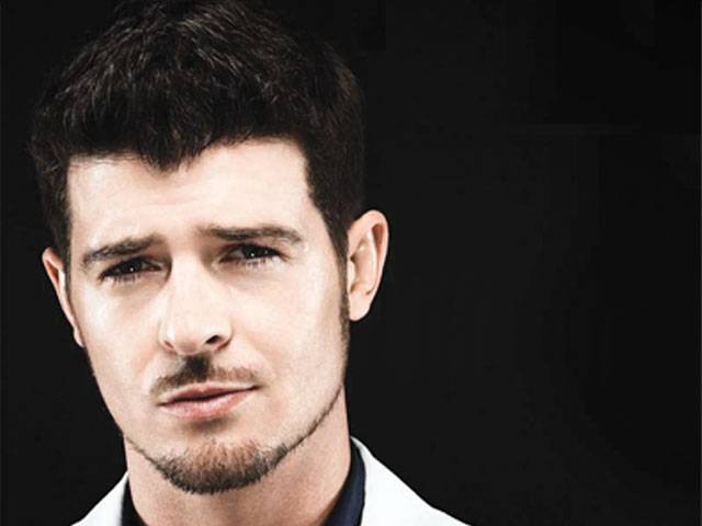 US singer Robin Thicke holds on to UK No 1